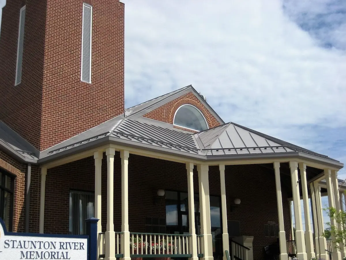 Skilled roofing craftsmen working on a residential roof in Lewisburg